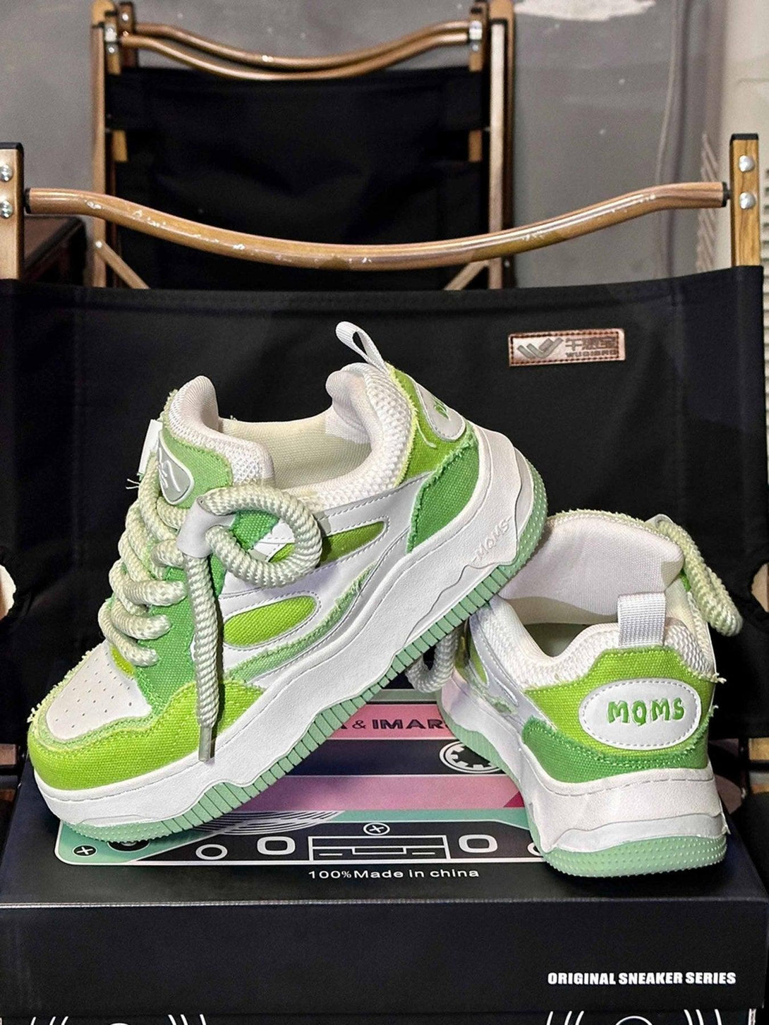 TALISHKO's green and white sneakers with thick soles and bold laces, perfect for a casual vibe.