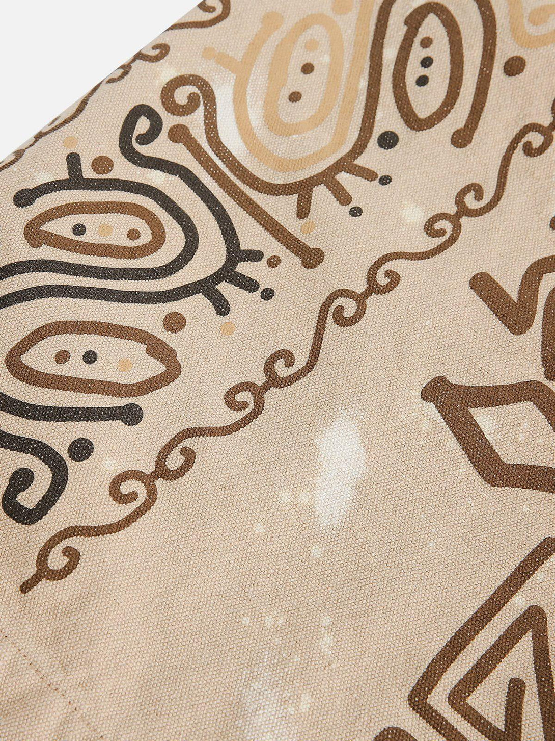 Intricate look at TALISHKO's desert graffiti print, showcasing earthy tones and artistic design.