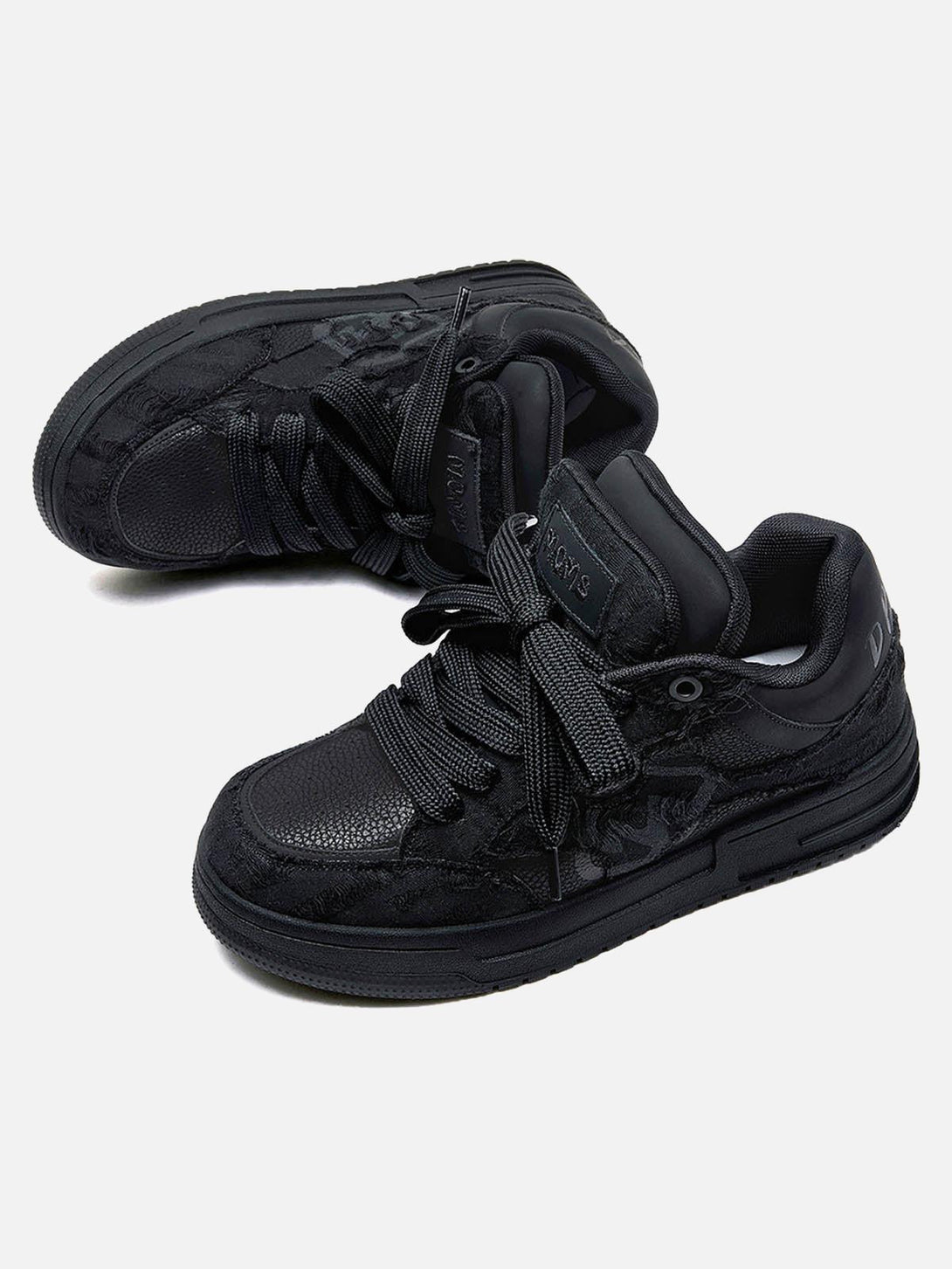 Intricate texture of TALISHKO's Destruction Black Knight skate shoes, highlighting design details.