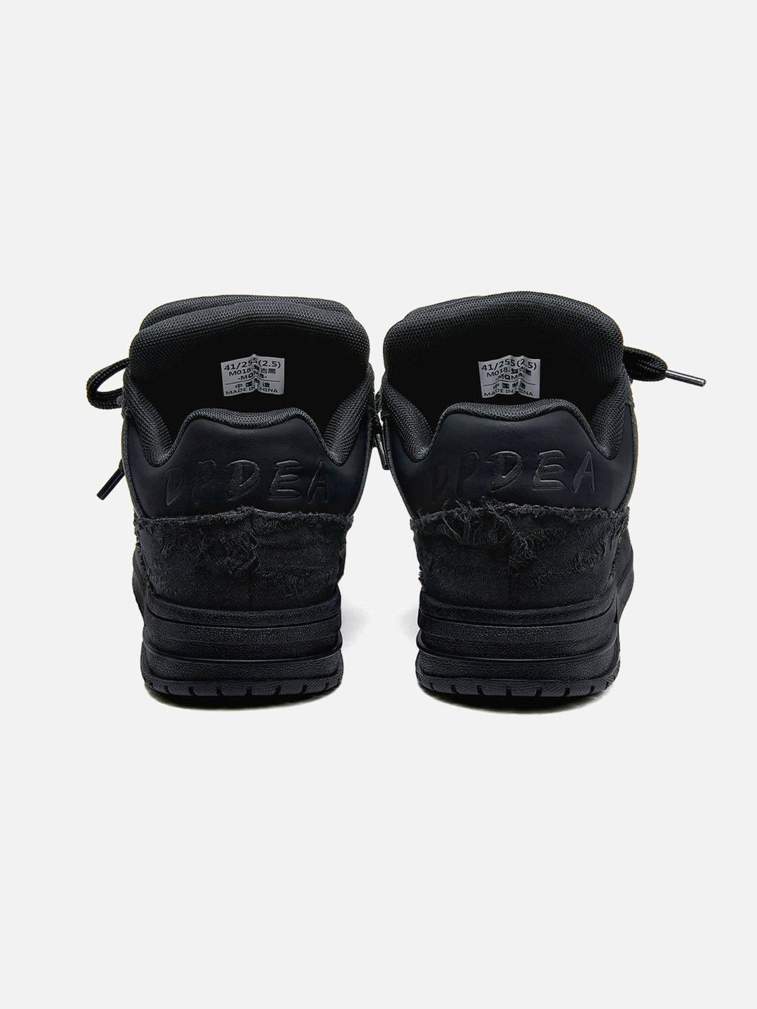 Back view of TALISHKO's Destruction Black Knight skate shoes with textured details.