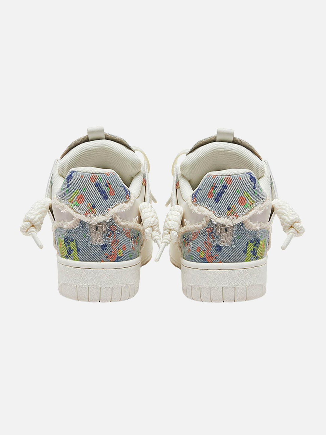 Back view of TALISHKO sneakers featuring colorful contrast details and tassel accents.