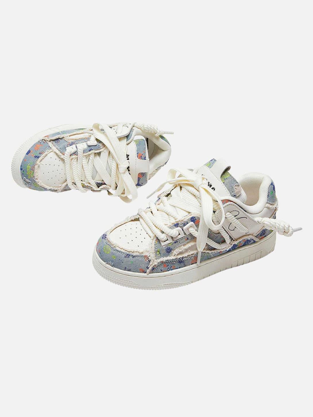 TALISHKO sneakers with a colorful tassel design and contrast stitching, shown from above.