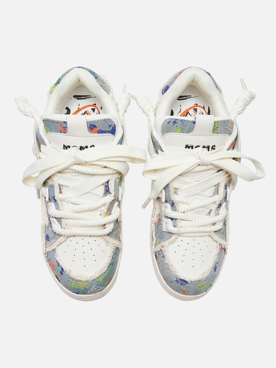 Top view of TALISHKO sneakers with colorful contrast patterns and unique tassel accents.