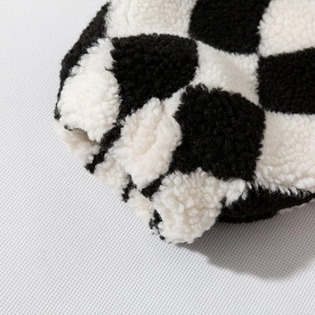 Zoomed-in view of TALISHKO's sherpa coat, showcasing the black and white diamond pattern.