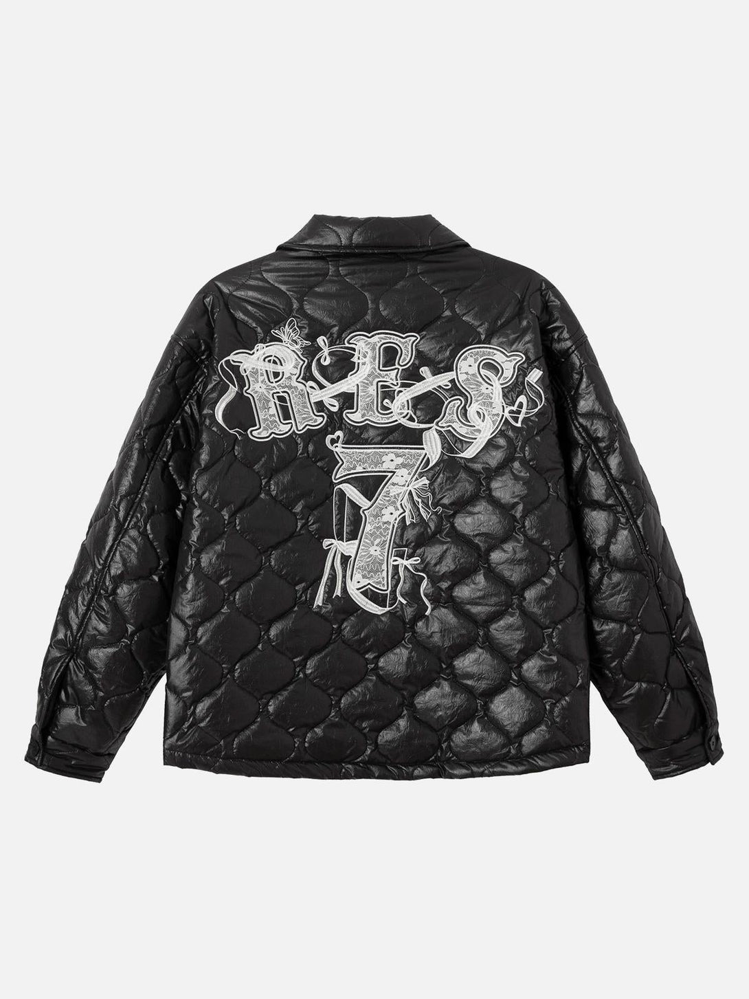 Back view of a TALISHKO diamond-quilted jacket with intricate letter embroidery design.