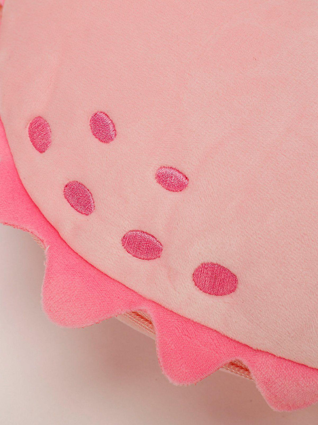 Intricate look at the playful pink dinosaur crossbody bag by TALISHKO, featuring unique details.
