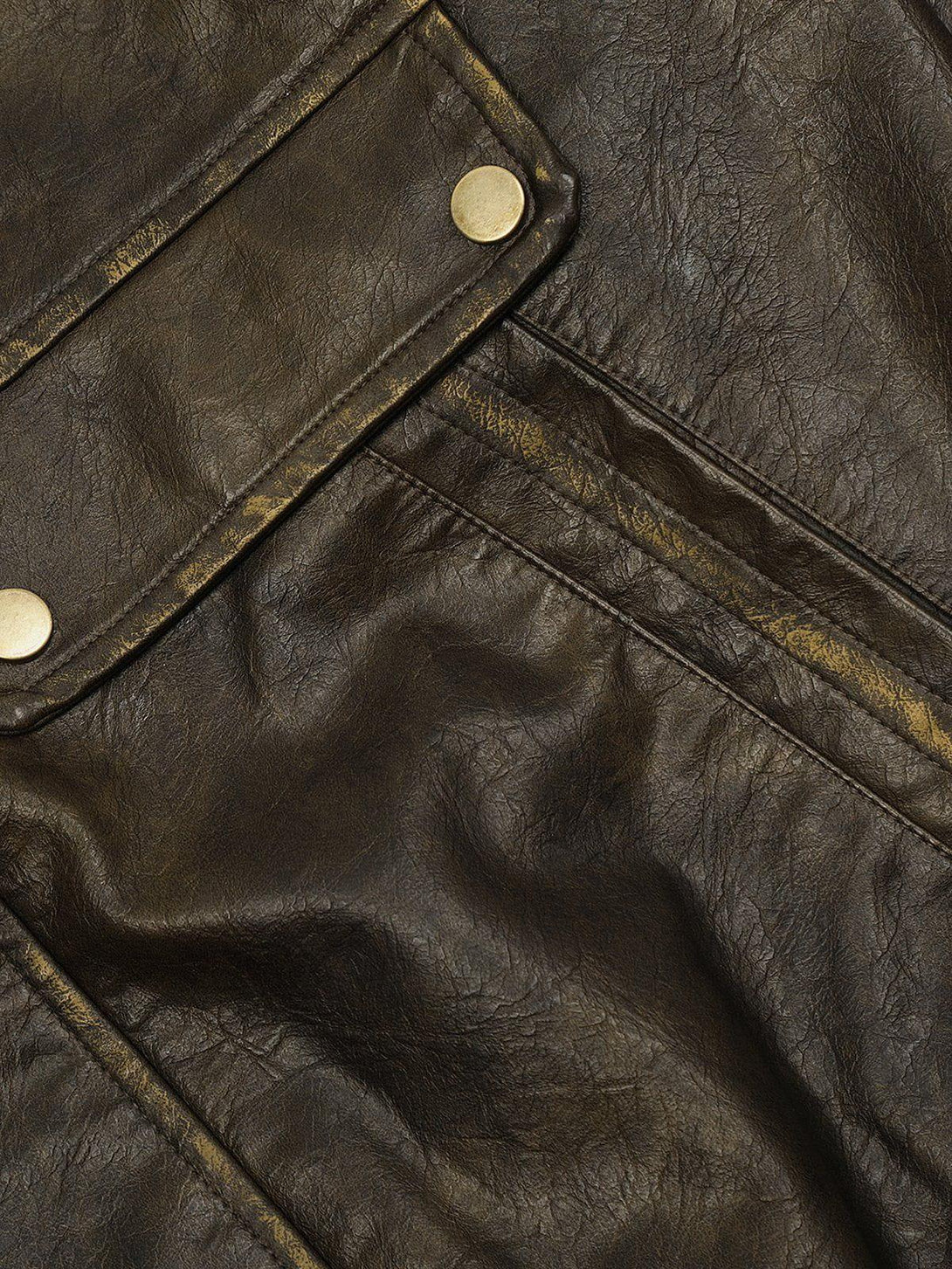 Zoomed-in texture of TALISHKO's dip-dye washed faux leather jacket, highlighting rugged details.