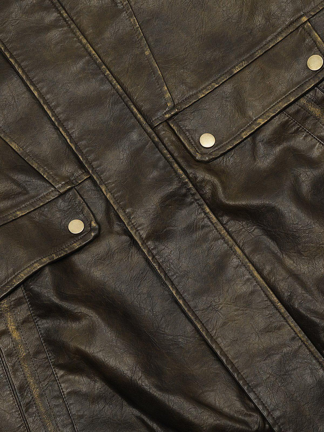 A detailed view of the dip-dye washed faux leather jacket by TALISHKO, highlighting texture.