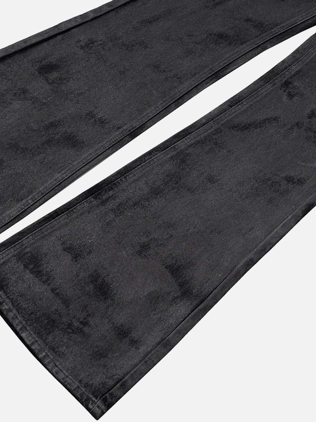 Detailed fabric and stitching of TALISHKO dip-dye washed jeans in a dark, versatile shade.