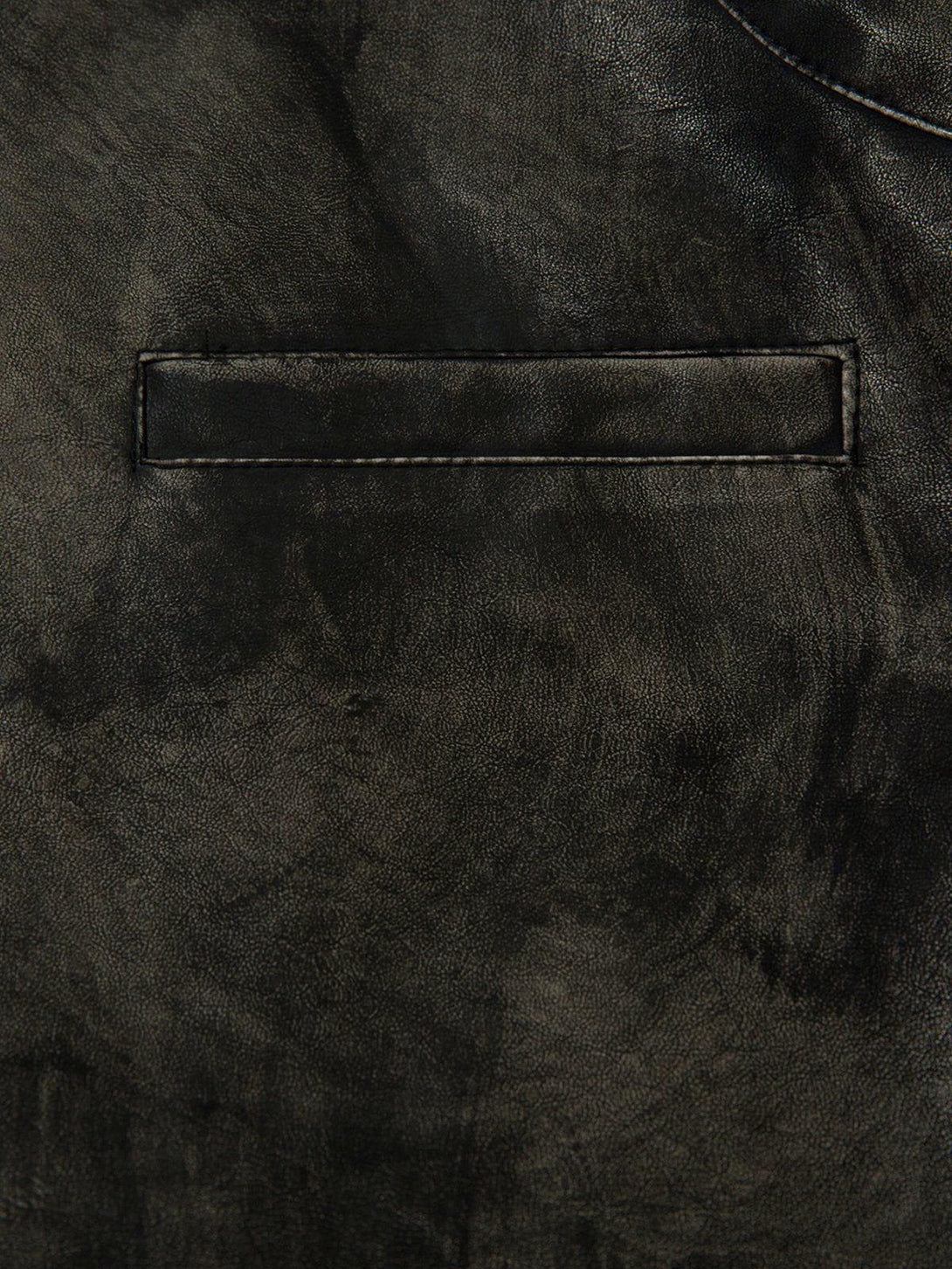 A detailed view of TALISHKO's dirt-colored faux leather jacket, showcasing its sleek pocket design.