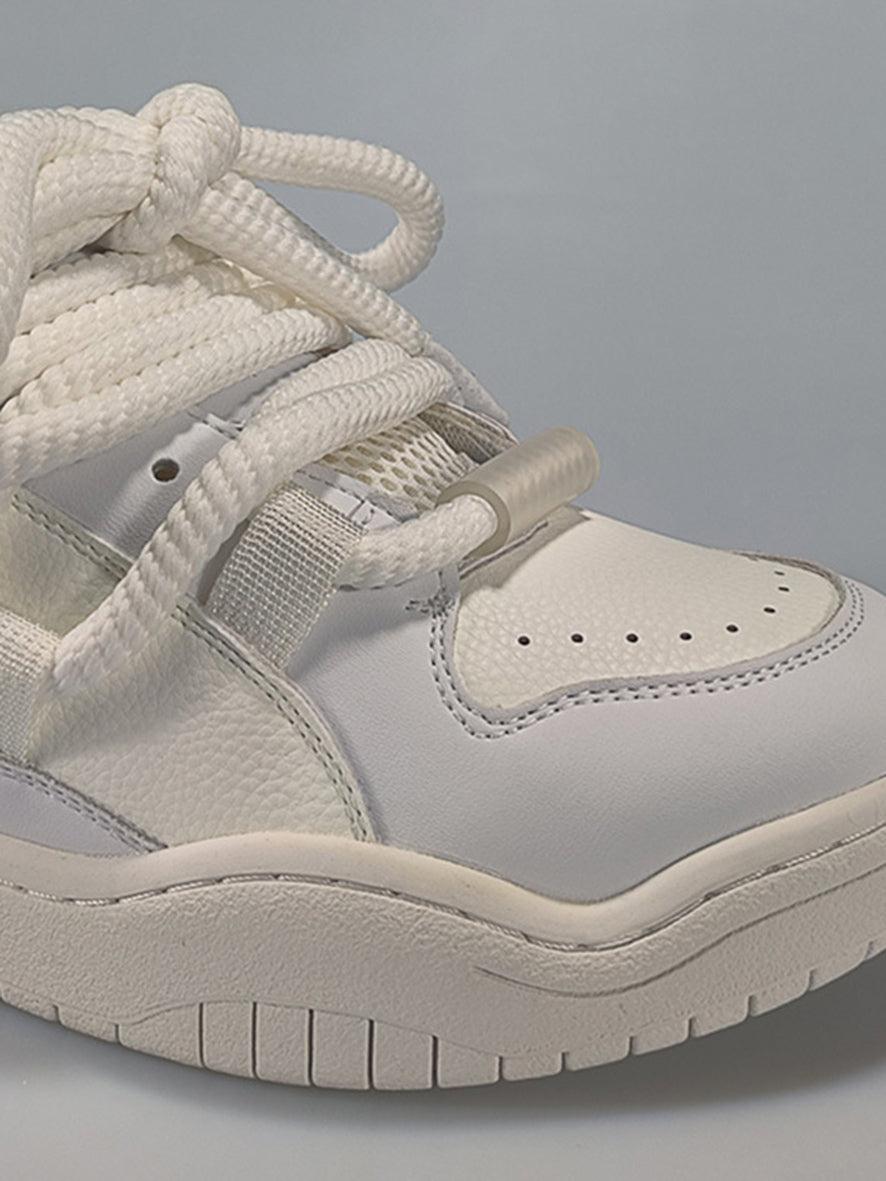 Intricate look at TALISHKO skateboard shoes, focusing on the braided lace and textured design.