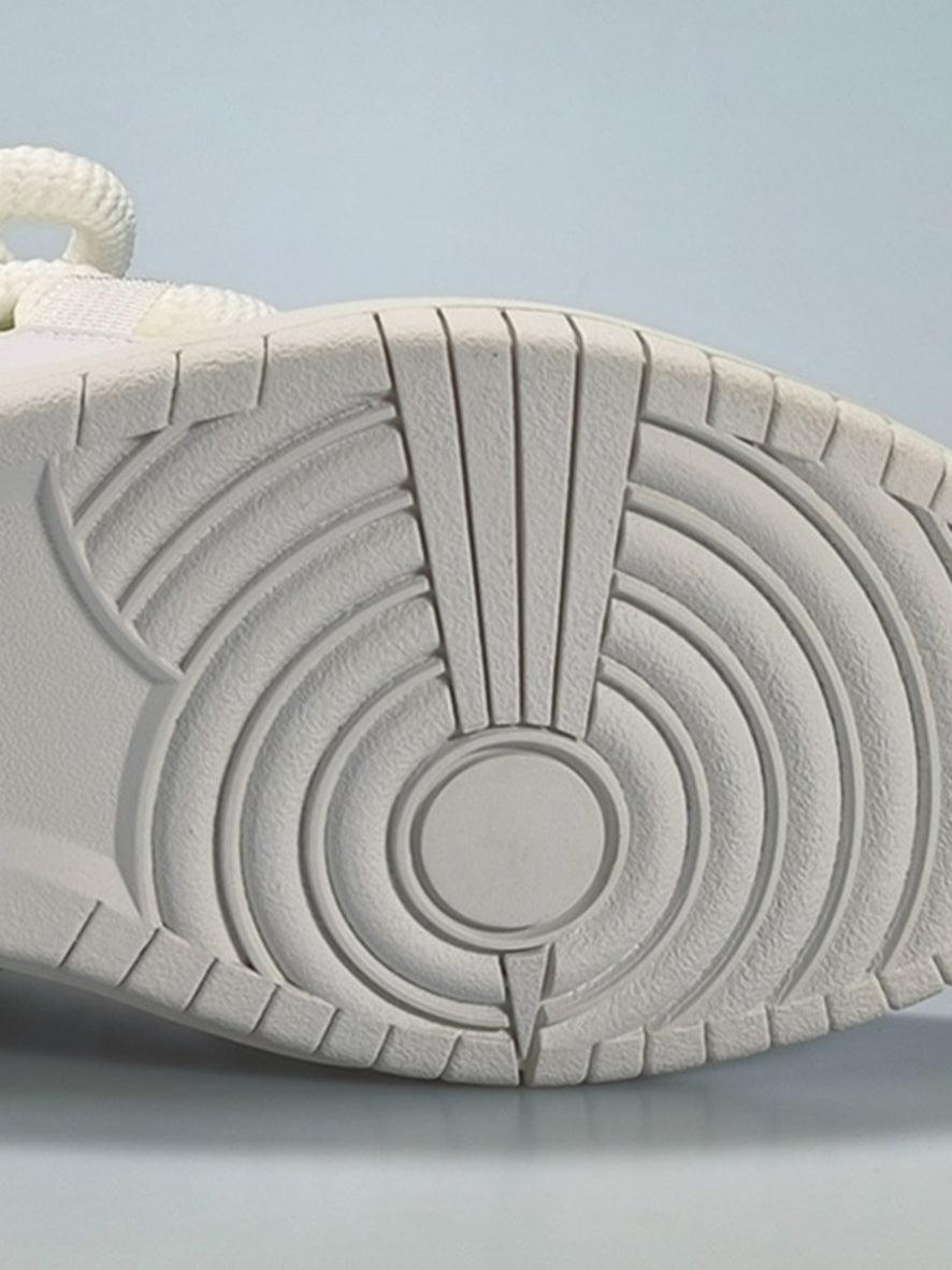 The sole design of TALISHKO skateboard shoes, featuring intricate circular patterns.