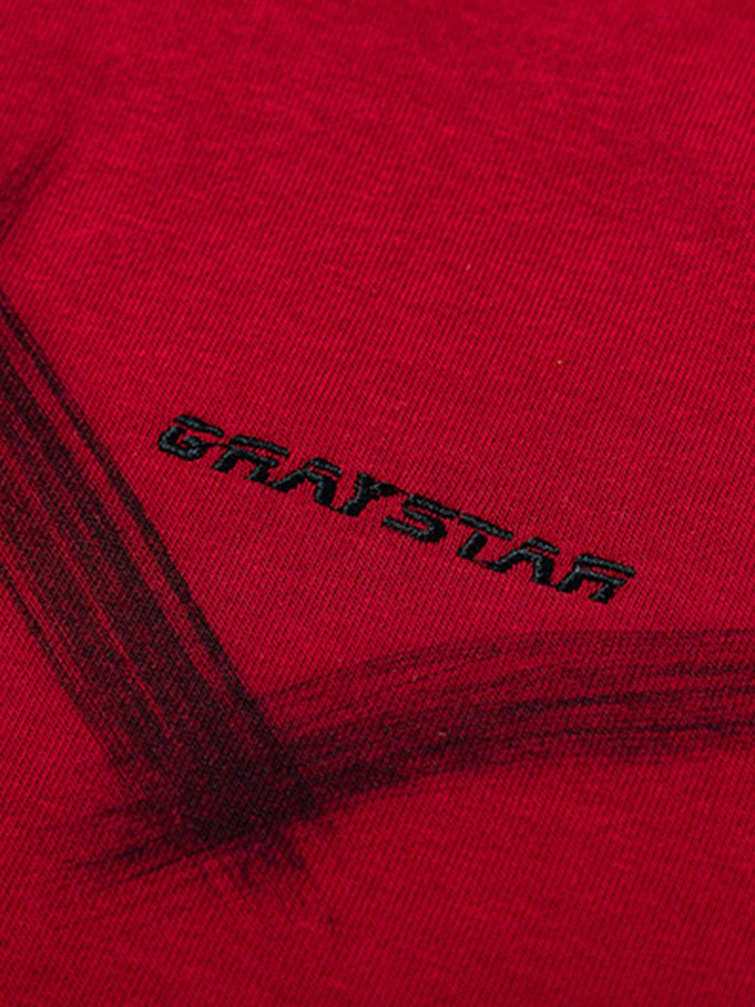 Intricate look at the TALISHKO hoodie fabric, showcasing bold brushstroke and graffiti design.