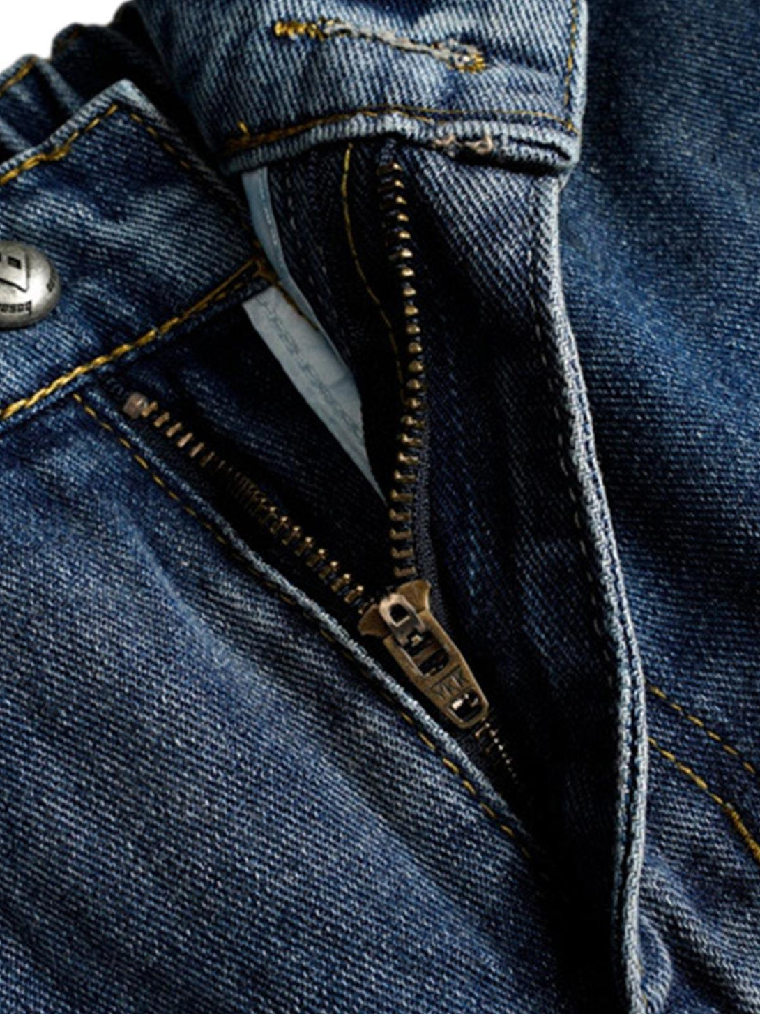 Close-up of TALISHKO baggy barrel jeans zipper, highlighting detailed stitching and texture.