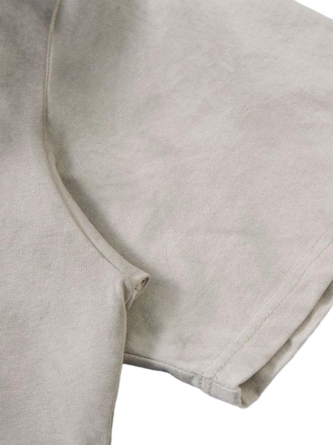 A detailed view of TALISHKO's dirty-dyed washed crew neck T-shirt, highlighting its soft texture.
