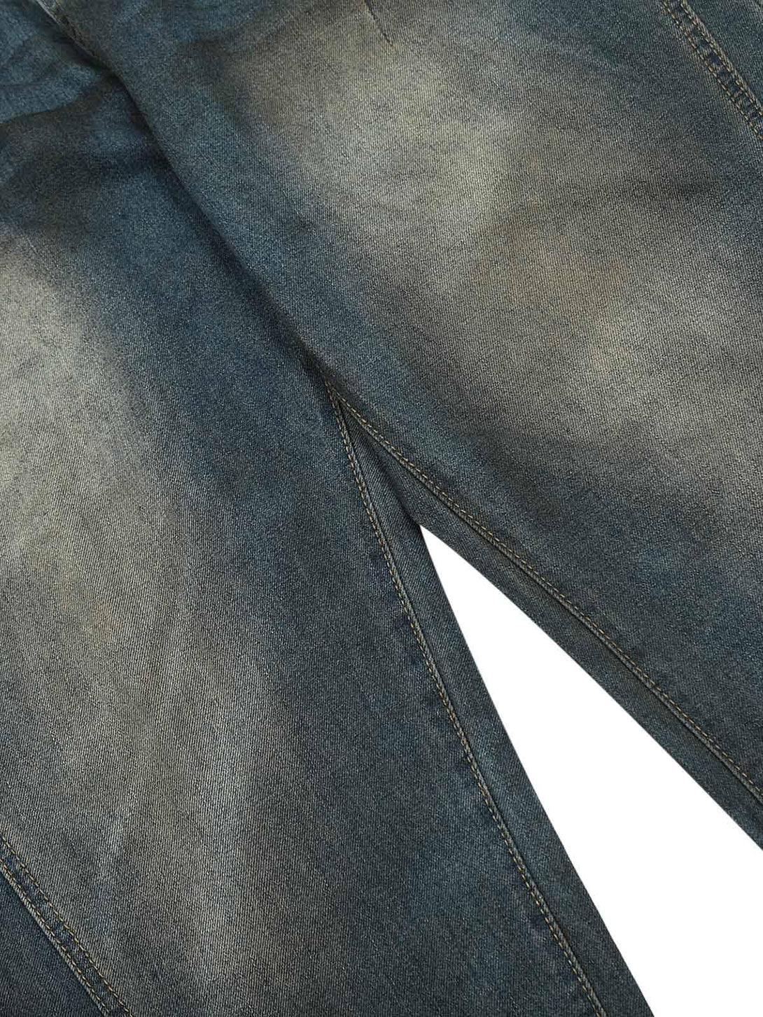 A detailed look at TALISHKO's straight jeans, highlighting the washed denim texture.