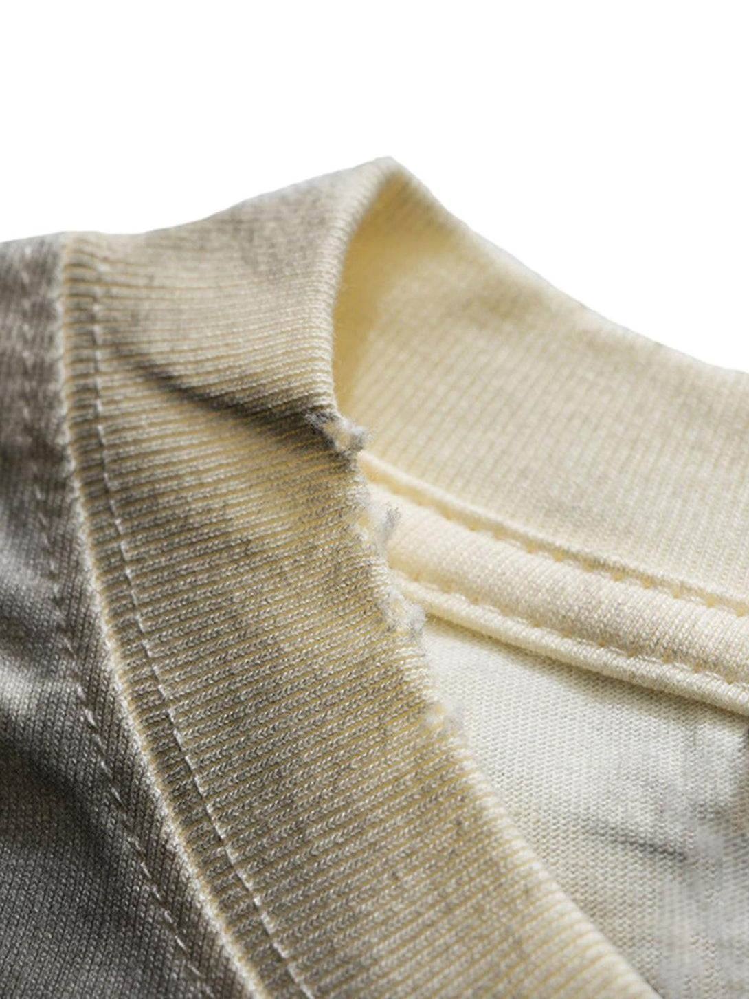 A tight crop highlighting TALISHKO T-shirt's fabric texture and stitching details.