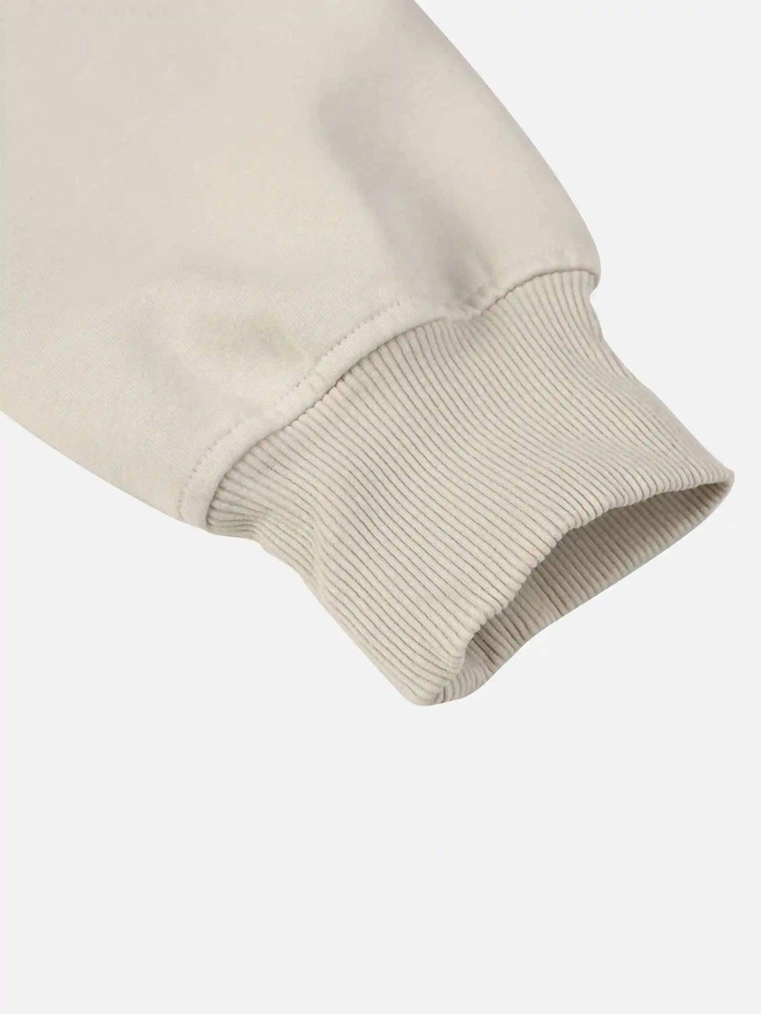 Focusing on the ribbed cuff design of the TALISHKO hoodie, highlighting its textured detail.