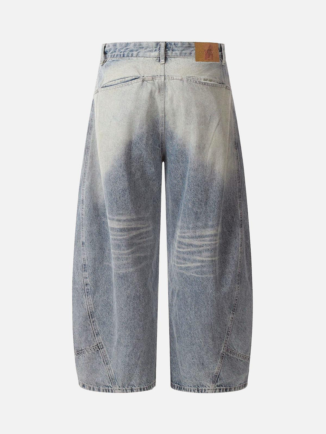Back view of TALISHKO distressed baggy barrel jeans, highlighting unique faded denim style.