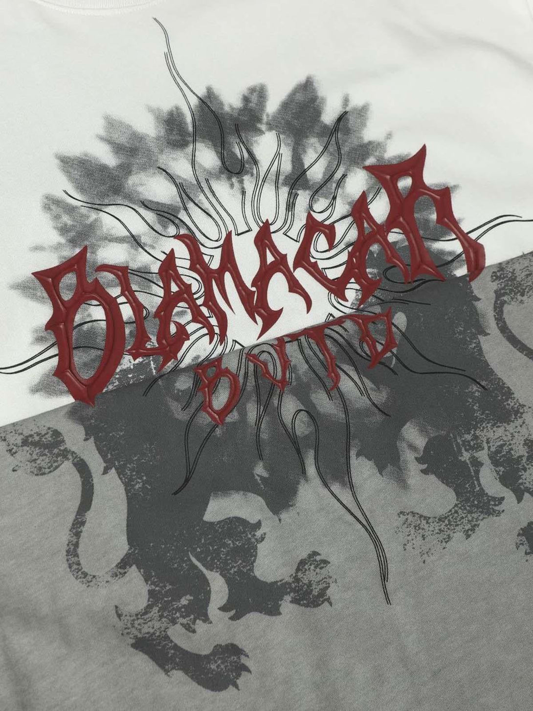 Intricate detailing on a TALISHKO distressed batik graphic T-shirt, showcasing bold patterns.