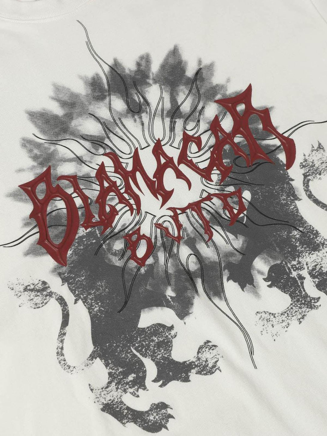 Intricate look at the bold design on a TALISHKO distressed batik graphic T-shirt.