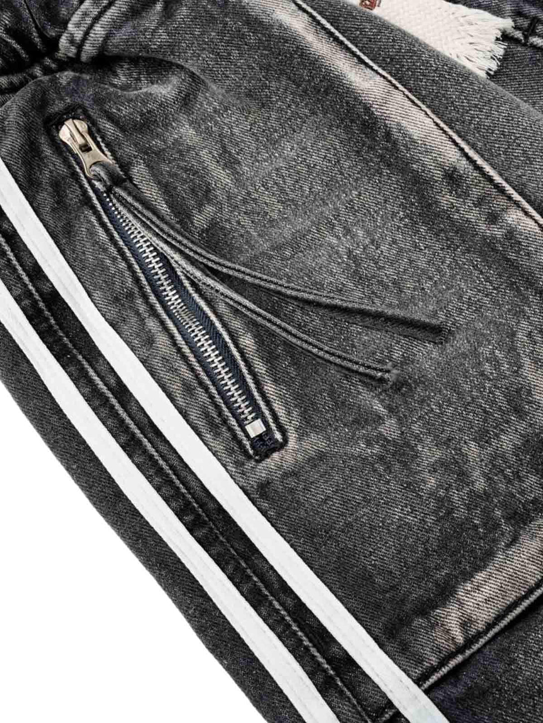 Intricate look at TALISHKO's distressed cargo denim shorts, highlighting zipper pocket detail.