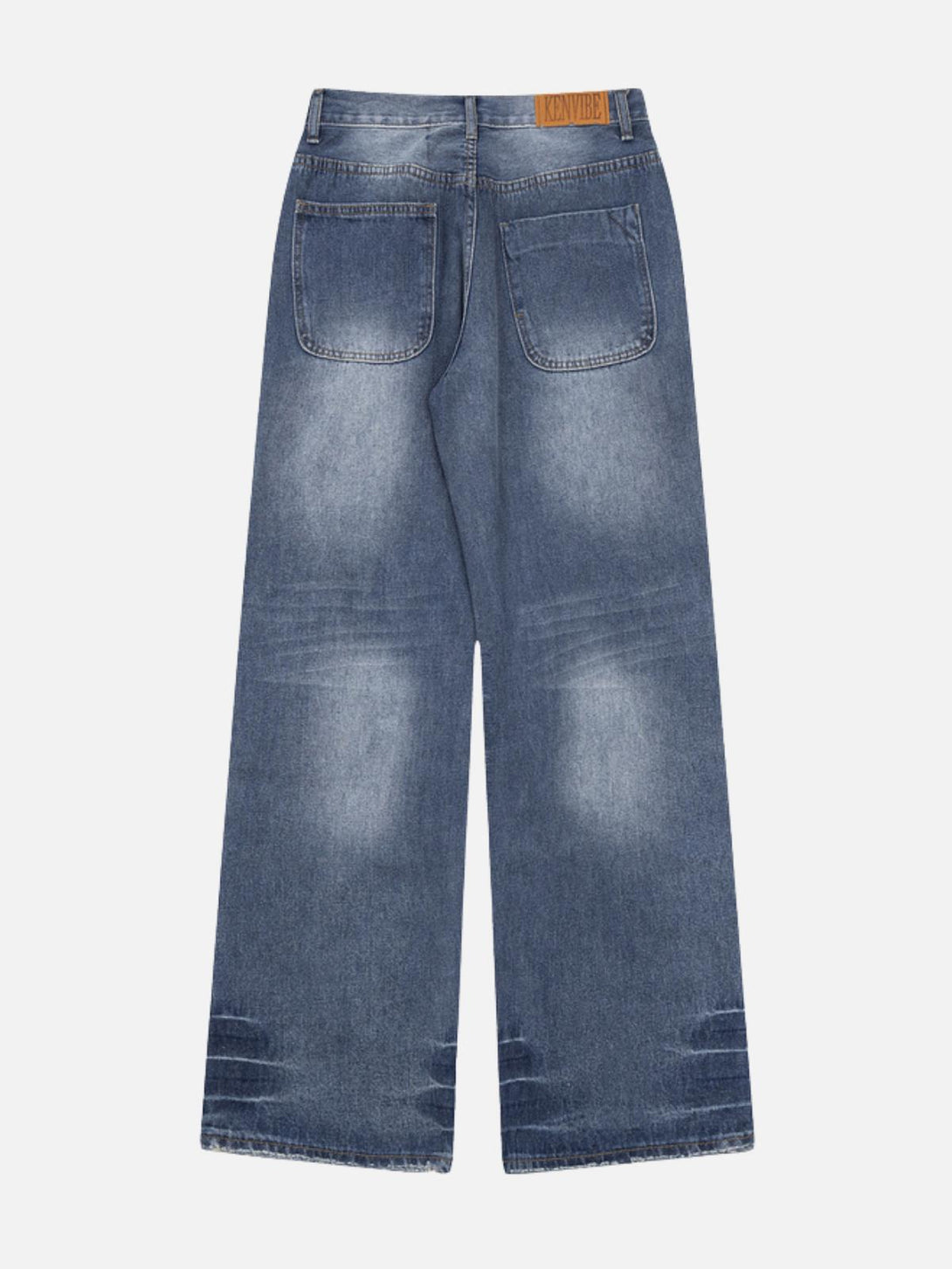 Back view of blue distressed loose jeans by TALISHKO, showcasing decorative details.