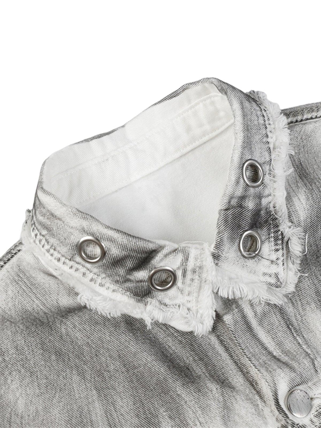 A detailed view of the distressed collar design on a denim jacket by TALISHKO, highlighting rugged style.