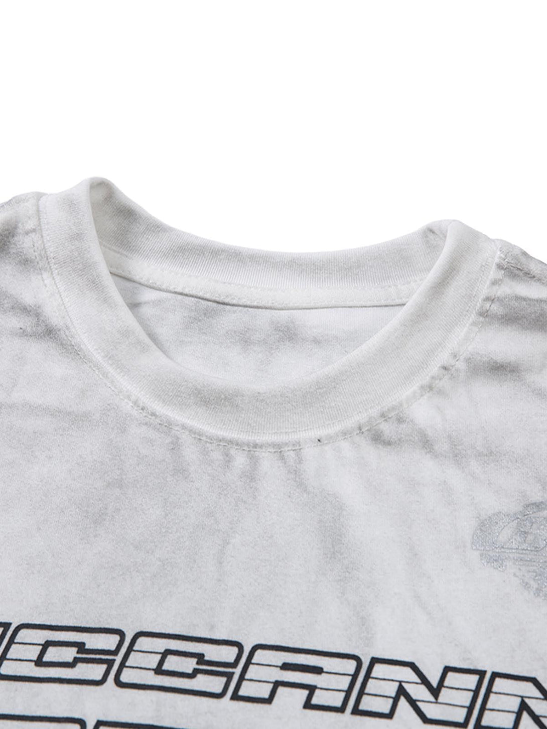 Neckline detail of a distressed print T-shirt by TALISHKO, highlighting unique dye effects.
