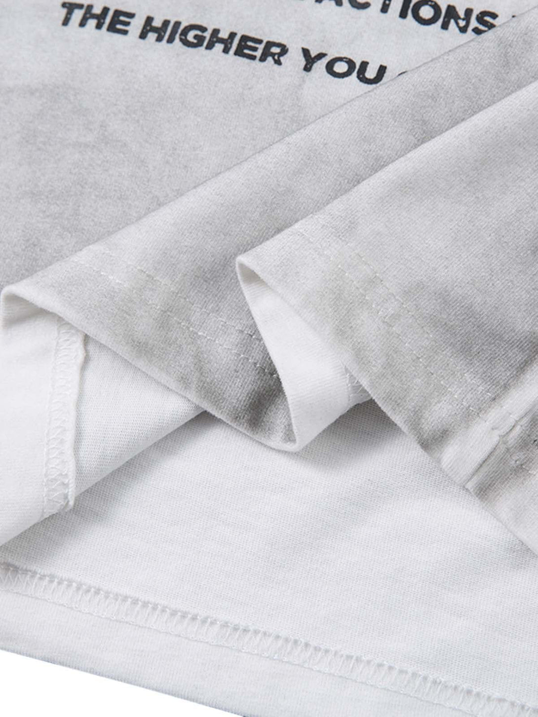 A tight crop highlighting the distressed fabric and print details on a TALISHKO T-shirt.