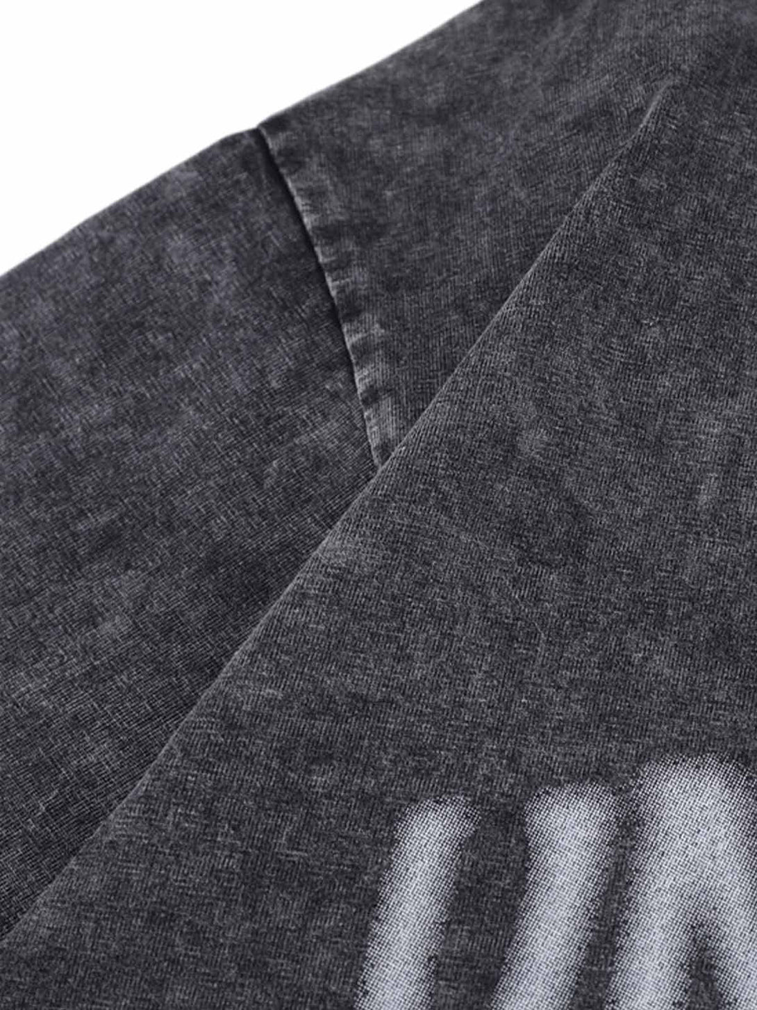 A close-up of TALISHKO's distressed polo shirt fabric, featuring unique texture and design.