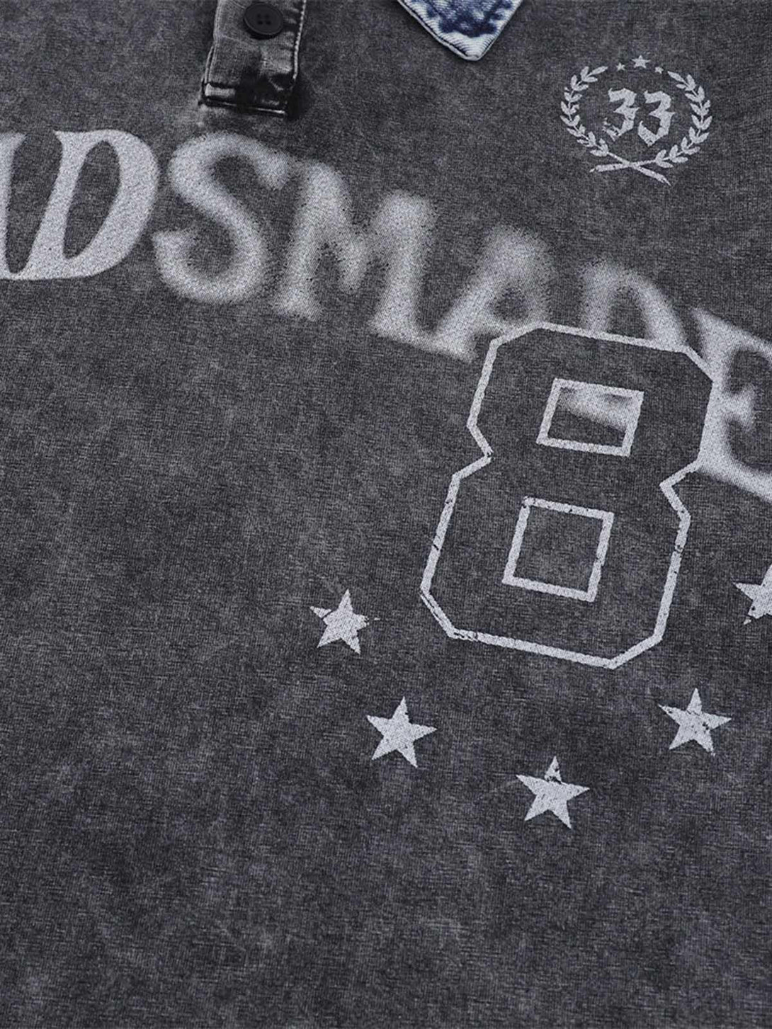 Distressed graphic details on TALISHKO's polo shirt, featuring a denim collar and unique design.