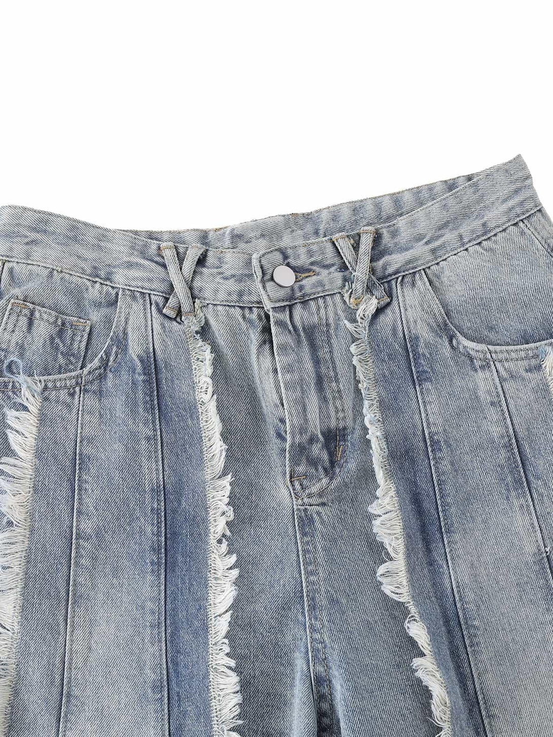 A close-up of TALISHKO's distressed baggy jeans, highlighting frayed edges and unique texture.