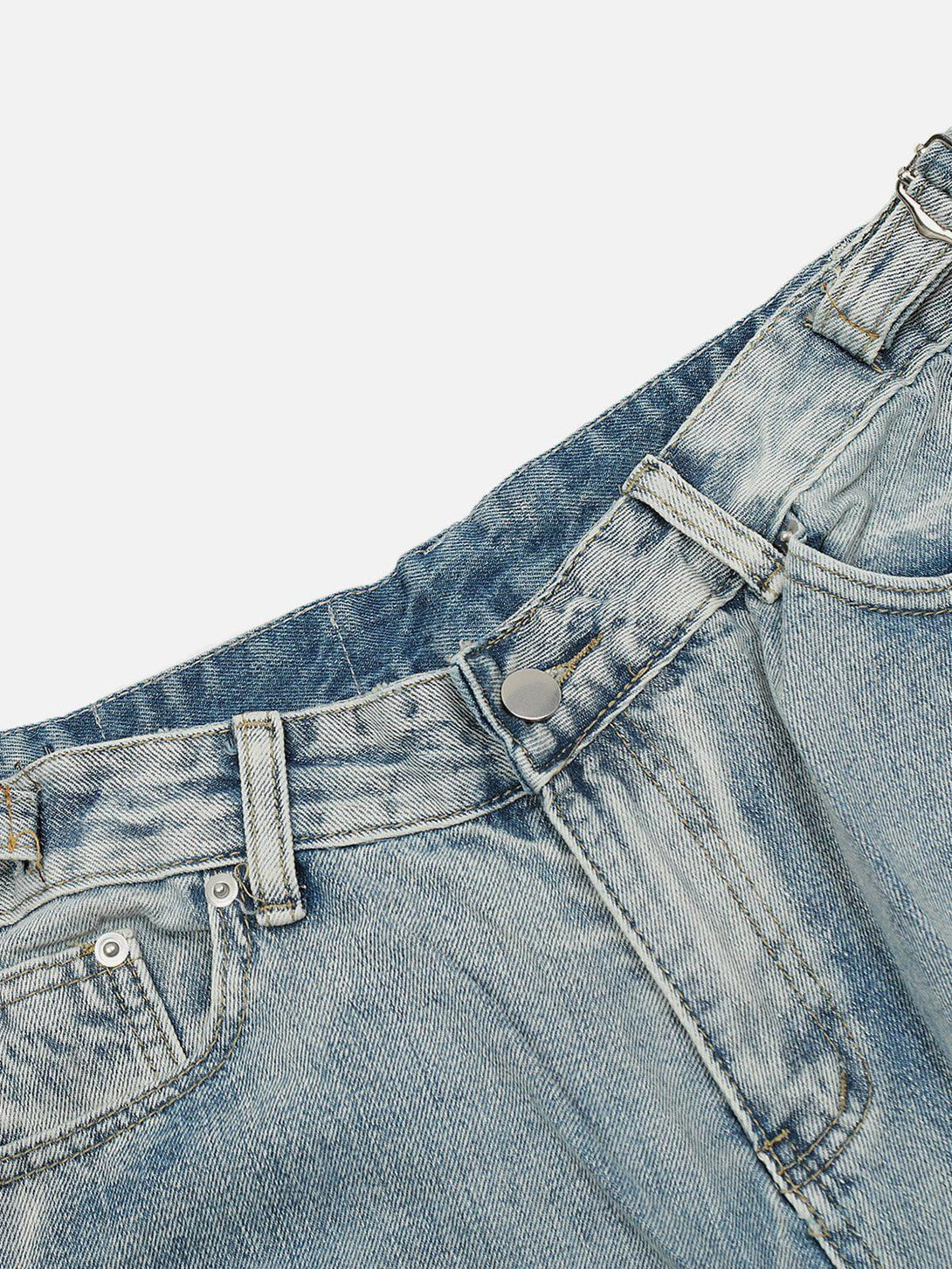 A detailed view of TALISHKO distressed fringe jorts, showcasing unique denim texture and style.