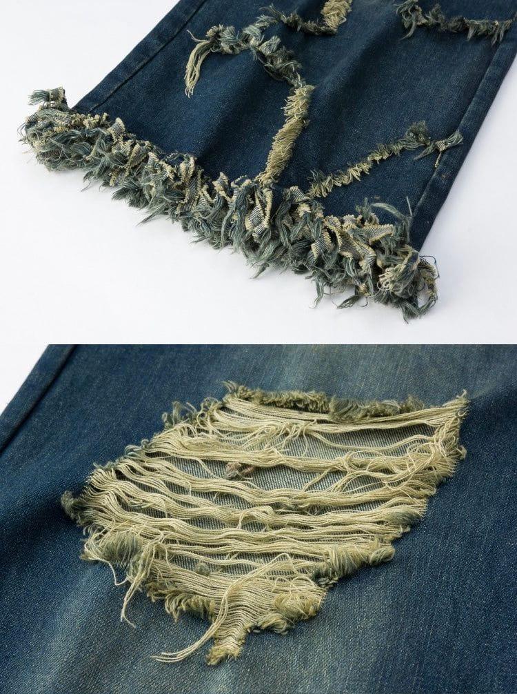Intricate look at TALISHKO distressed fringe star jeans, highlighting unique ripped detailing.