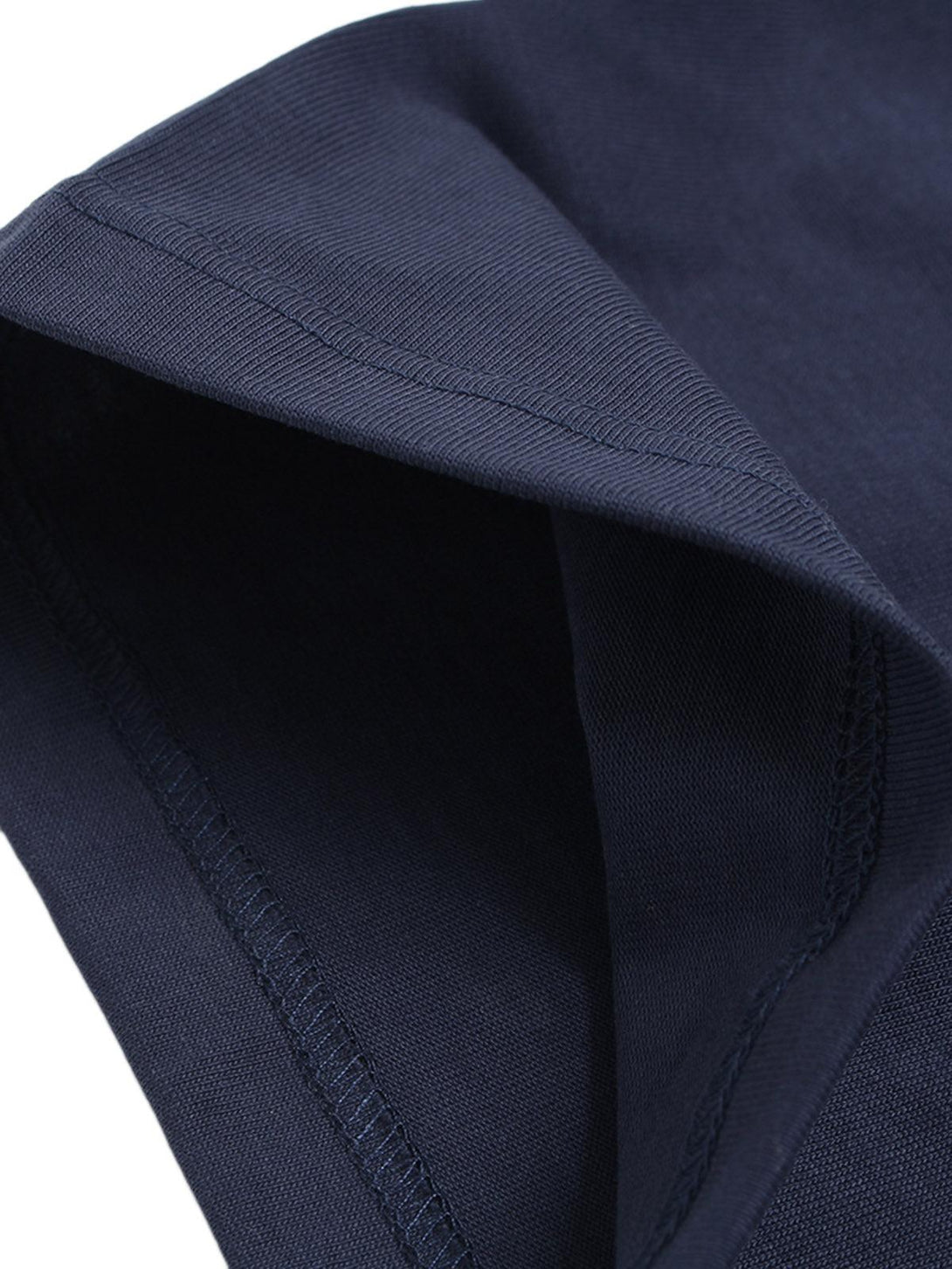 Detailed fabric and stitching on a navy crew neck T-shirt by TALISHKO, highlighting quality.
