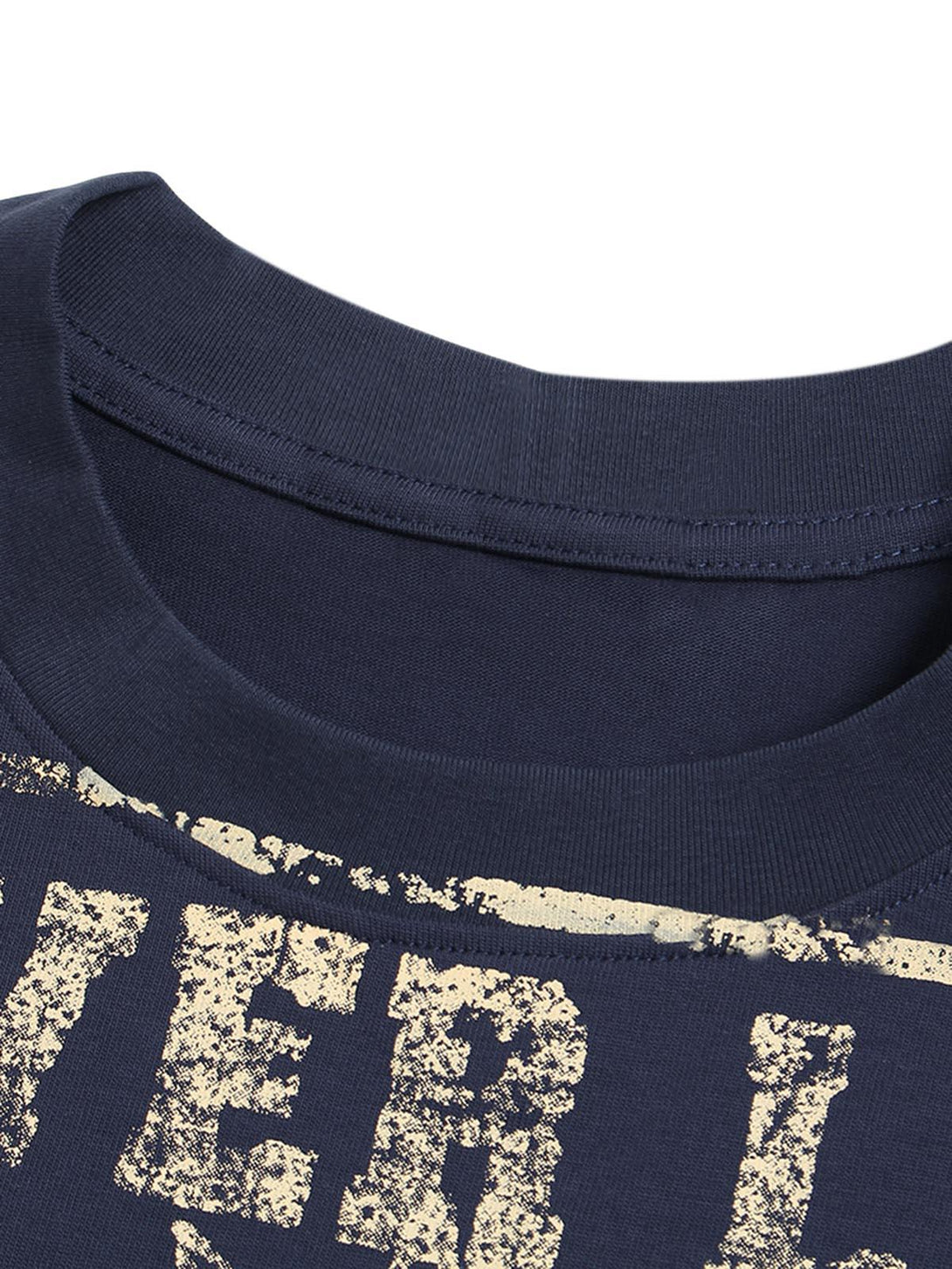 Focusing on the neckline of a navy crew neck T-shirt by TALISHKO, showcasing distressed print detail.