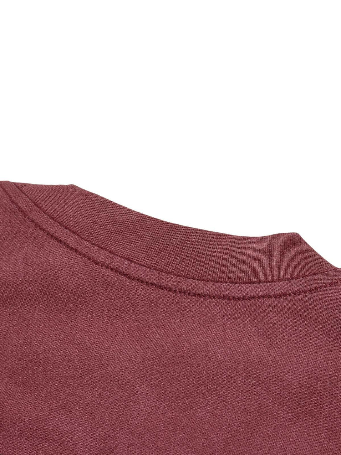 A detailed view of the TALISHKO T-shirt neckline, showcasing fine stitching and rich fabric.