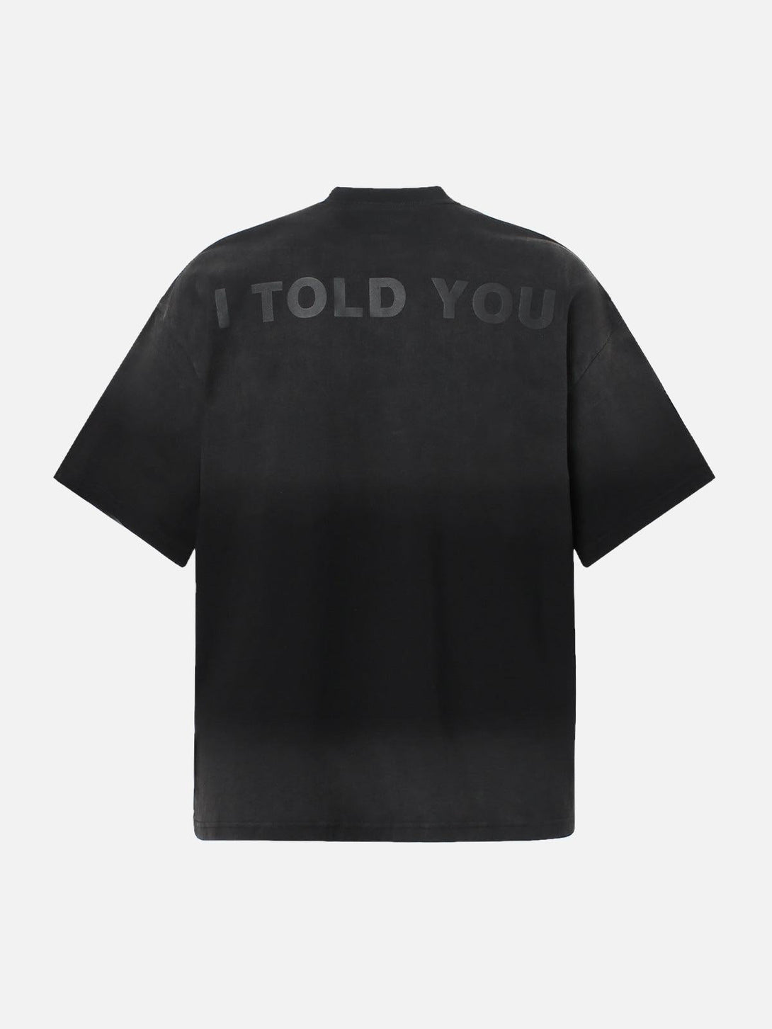 Back view of a black TALISHKO T-shirt featuring subtle lettering and a relaxed fit.