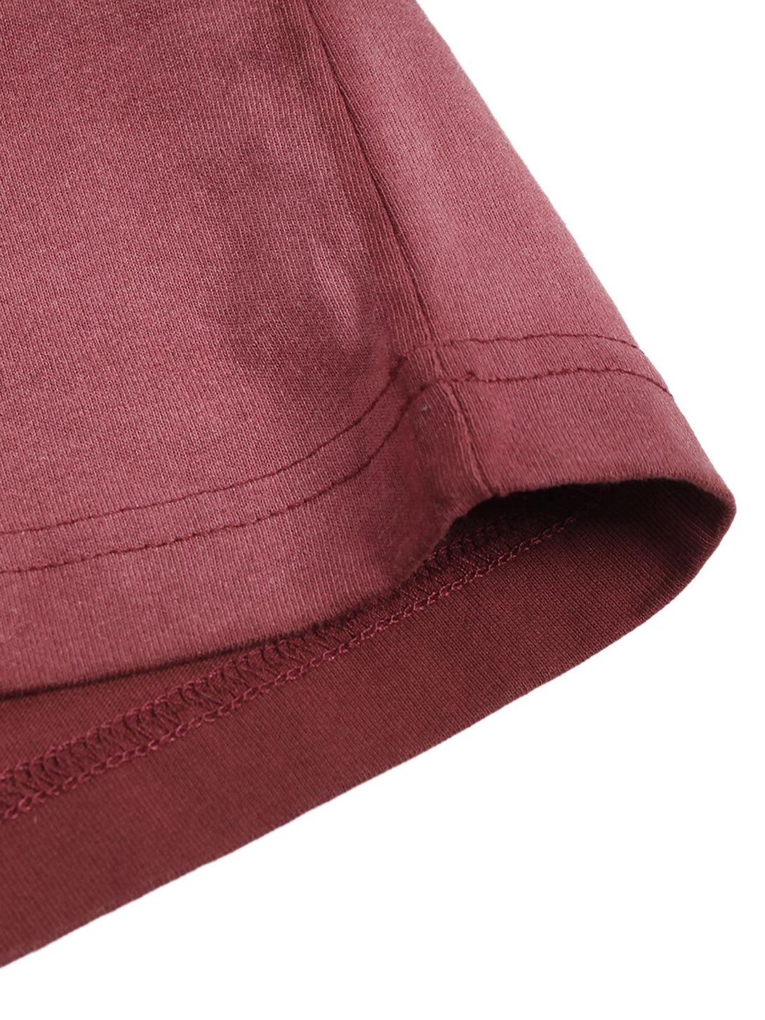 A close-up of TALISHKO T-shirt sleeve, highlighting the stitching and rich red fabric texture.