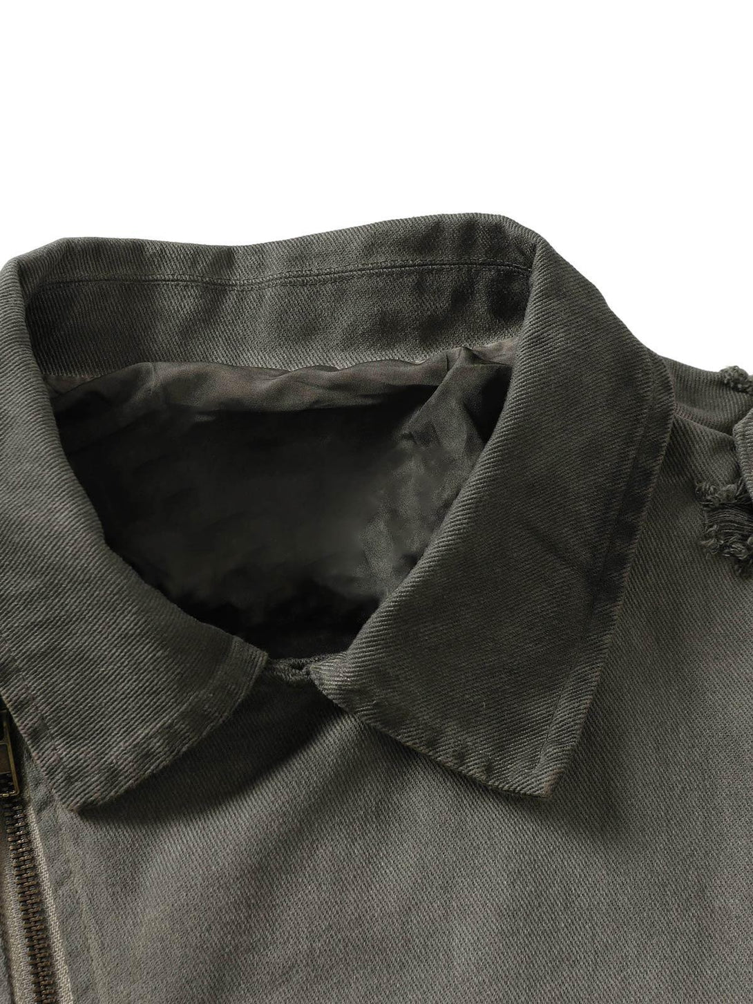 TALISHKO denim jacket collar detail showcasing distressed fabric and unique stitching.