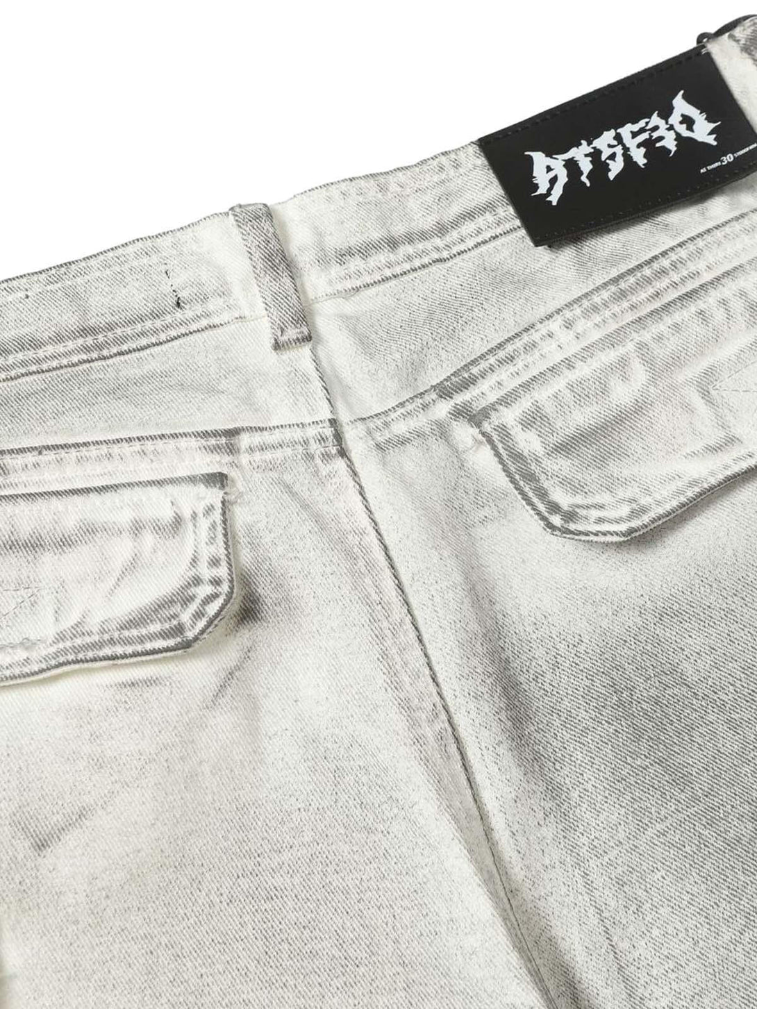 Back detail of TALISHKO distressed cargo shorts, showcasing rugged pockets and unique style.