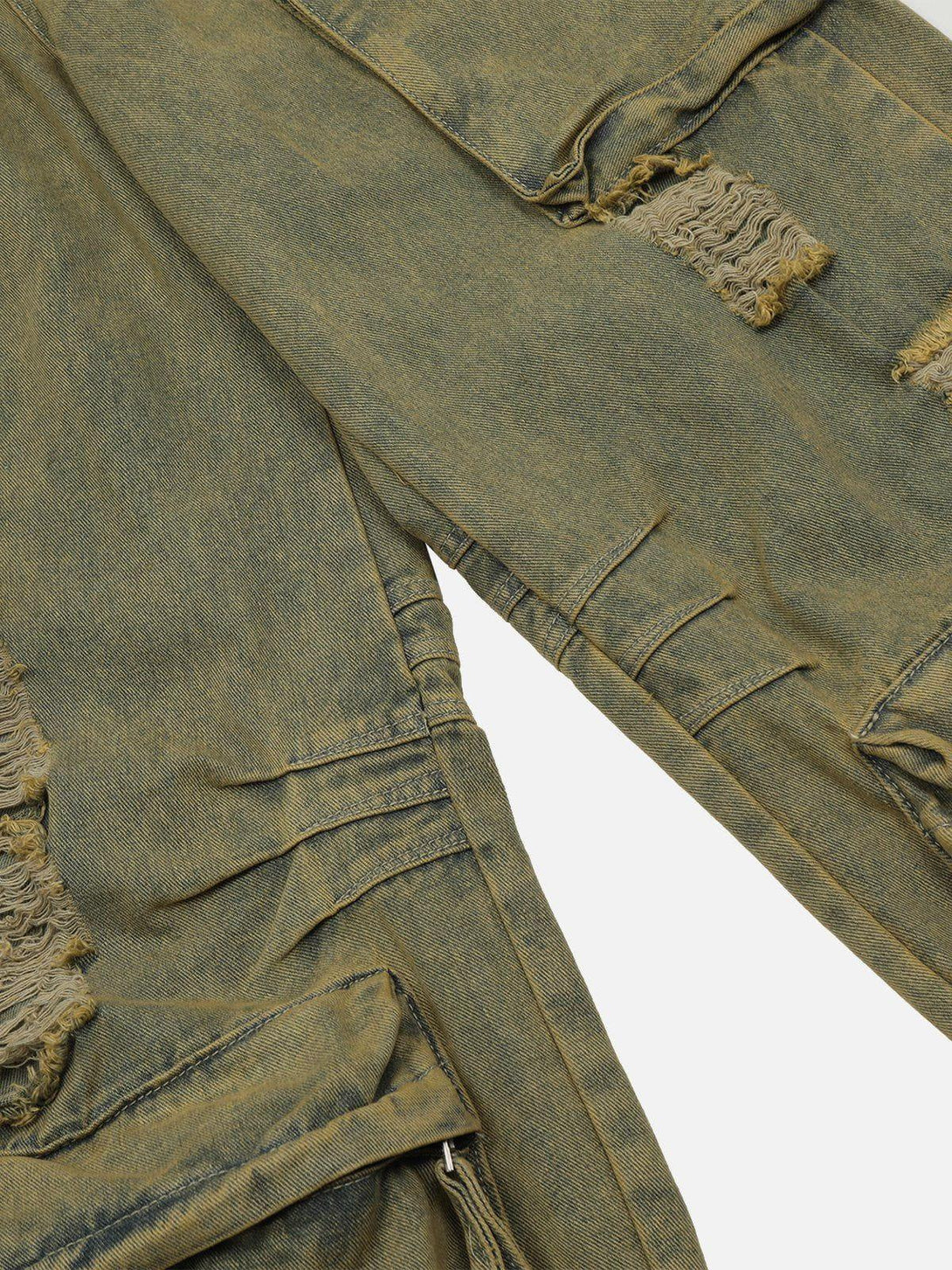 A detailed view of TALISHKO's distressed jeans, highlighting unique texture and pocket design.