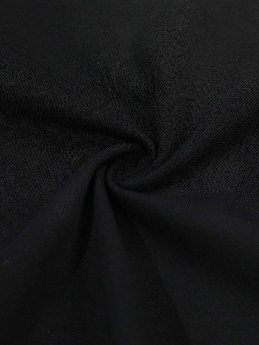 Zoomed-in texture of black fabric by TALISHKO, highlighting the soft material of the long sleeve t-shirt.