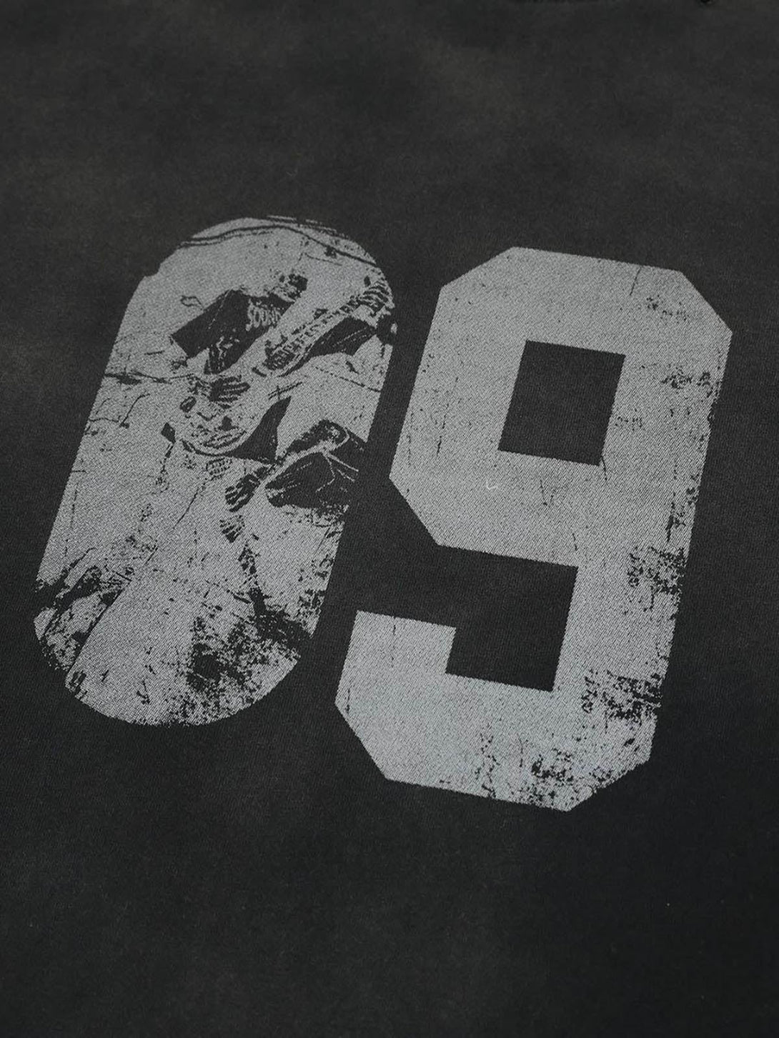 A detailed view of the distressed "09" graphic on a TALISHKO long sleeve t-shirt.