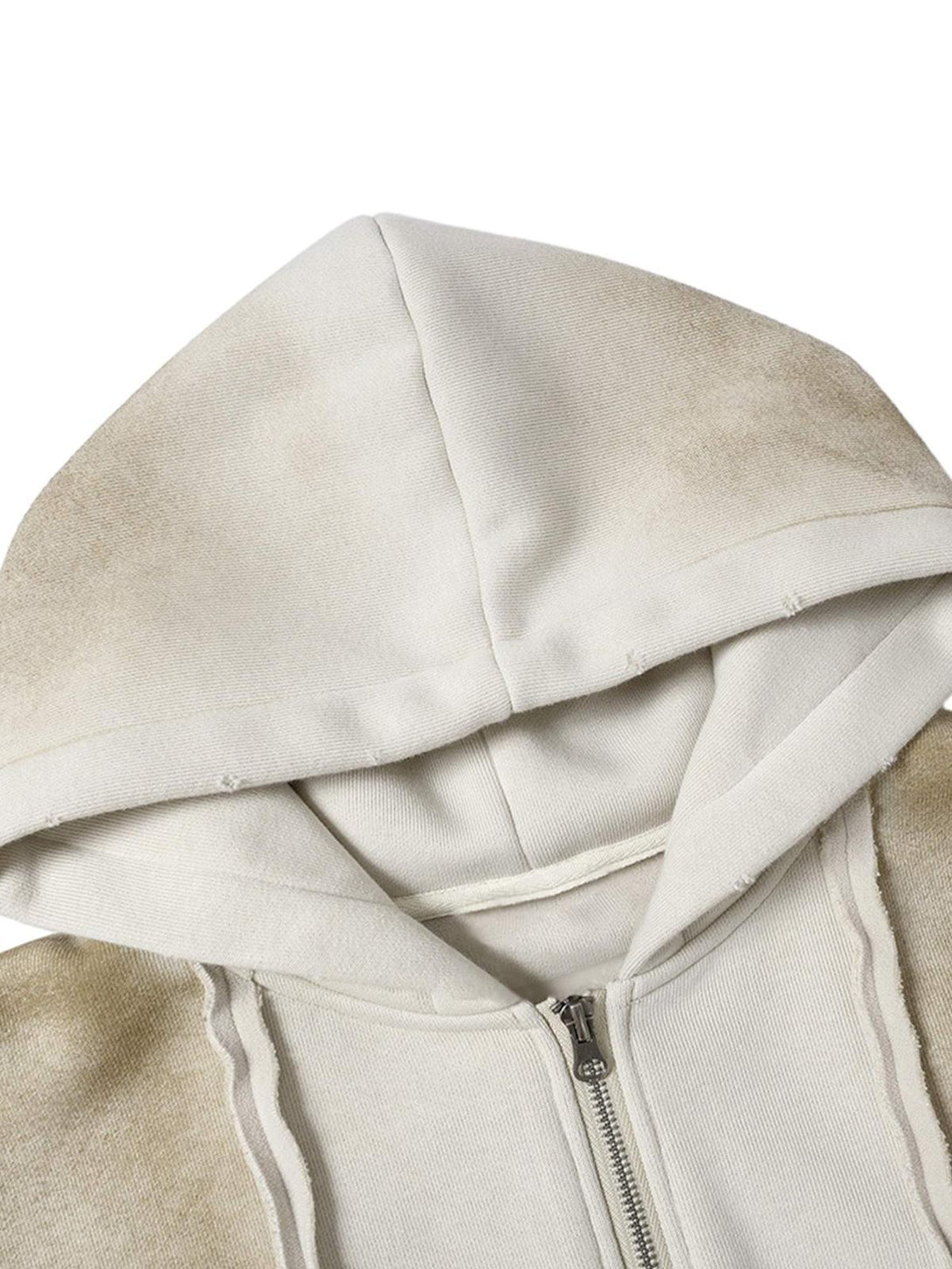 Zoomed-in view of TALISHKO jacket hood, highlighting distressed patchwork and texture.