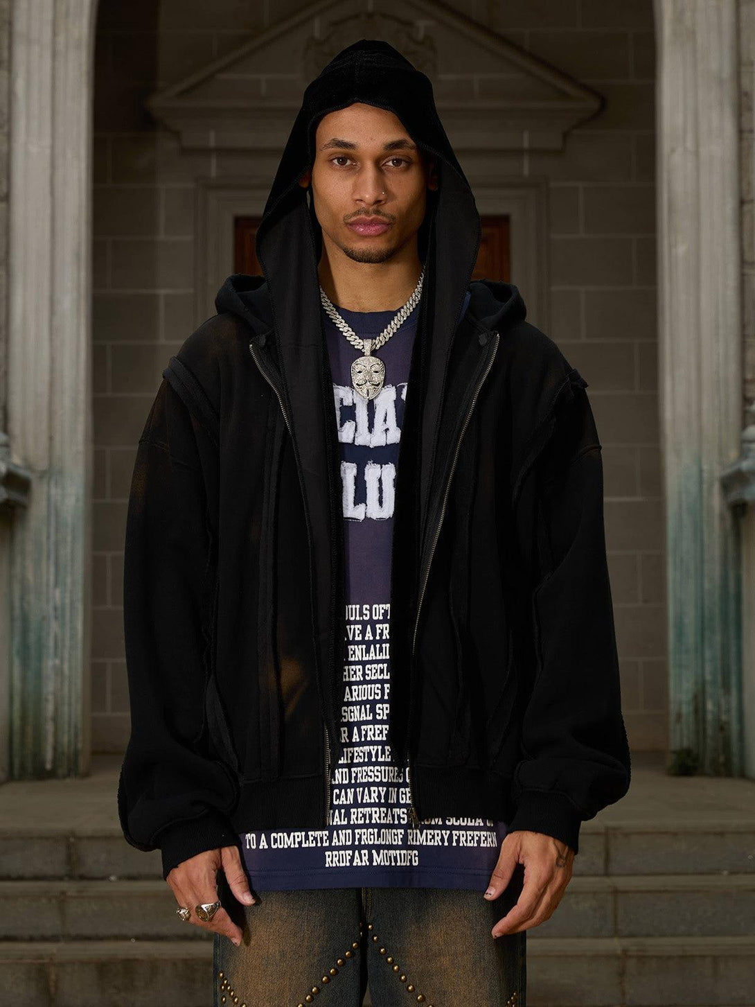 Model wearing TALISHKO distressed patchwork velvet jacket, styled with casual layered look.