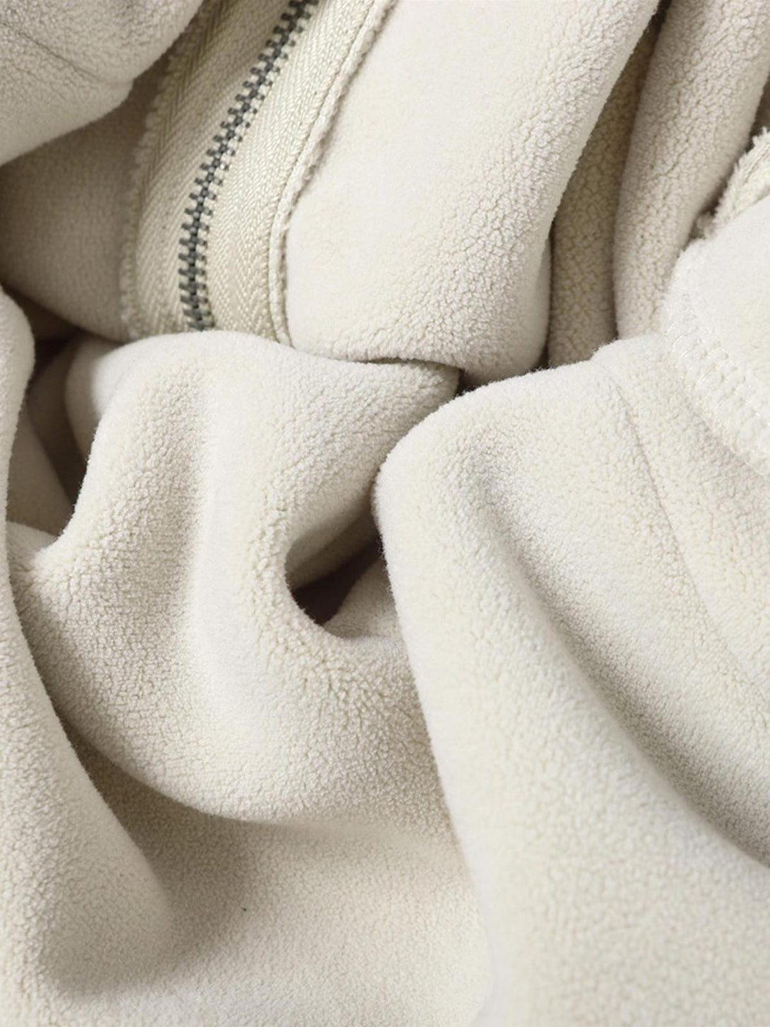 Zoomed-in texture of TALISHKO distressed patchwork velvet jacket, highlighting intricate details.