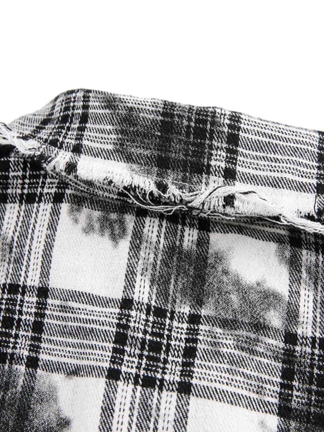A detailed look at the distressed plaid pattern on TALISHKO's lace short-sleeve shirt.