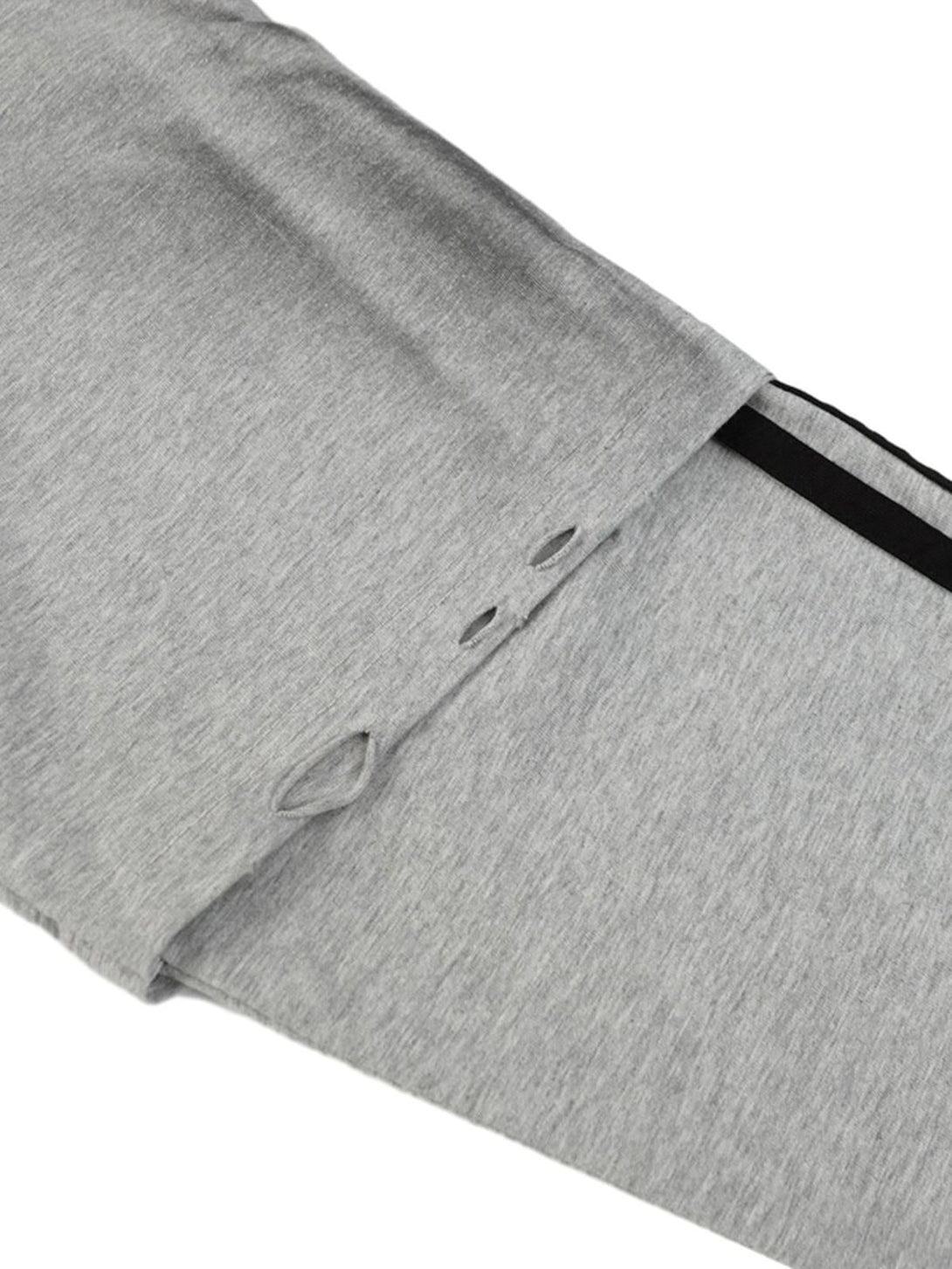 A detailed view of TALISHKO's gray faux two-piece T-shirt, highlighting its sleeve design.
